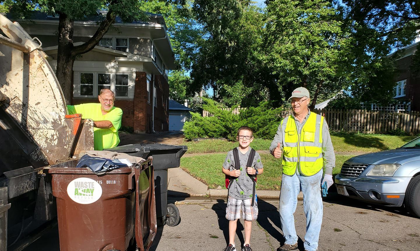 First day pose with the trash men.jpg